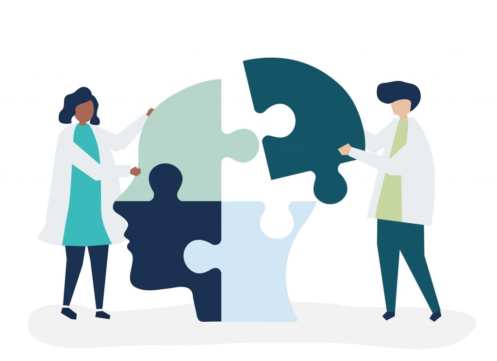 People connecting jigsaw pieces of a head together Image